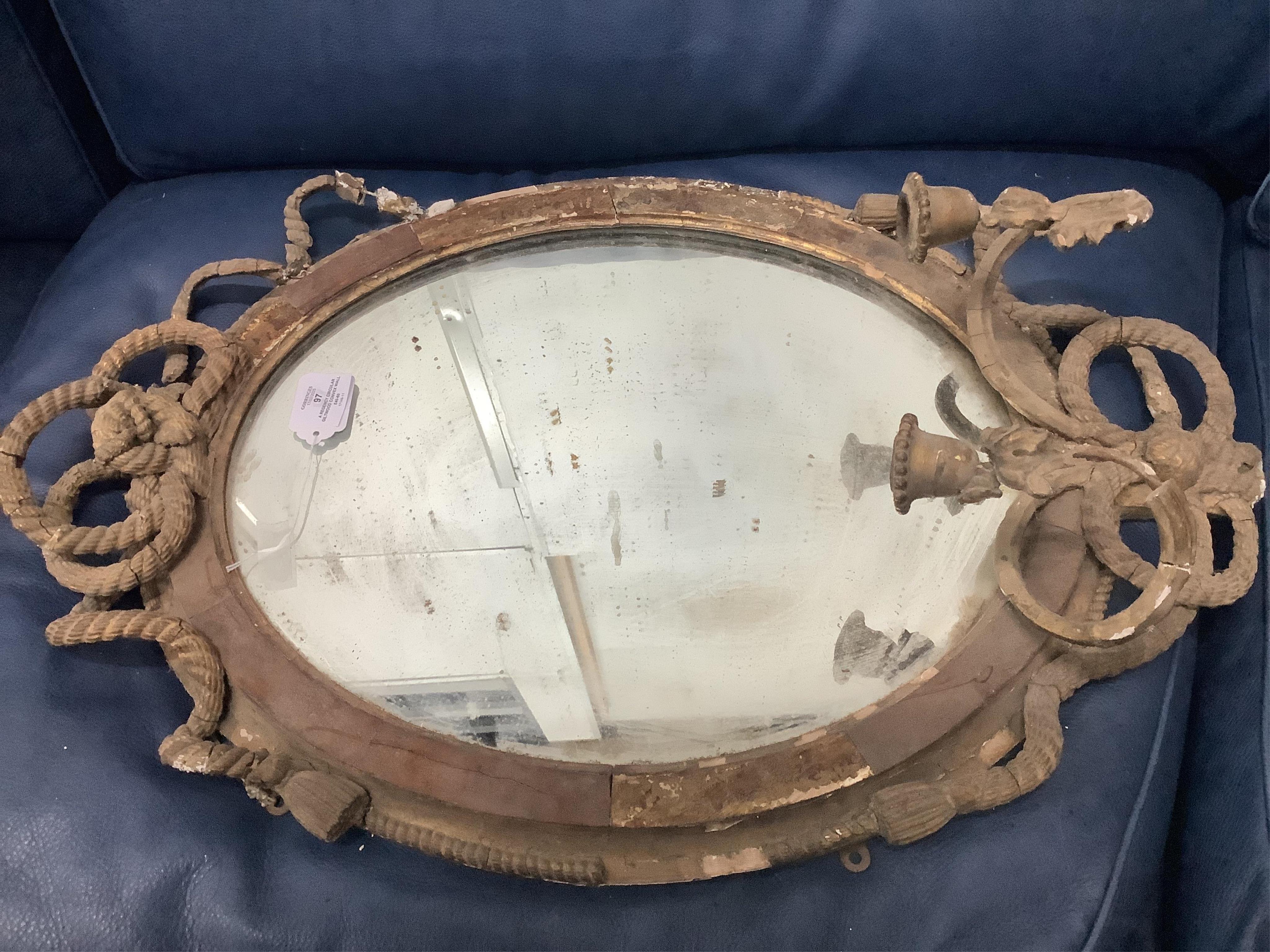 A Regency circular giltwood convex wall mirror with lion pediment, diameter 65cm a Regency convex mirror frame and Victorian girandole. Condition - poor